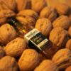Whiskey bottle surrounded by walnuts, showcasing rustic elegance.