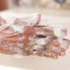 A detailed shot of hands covered in soap lather, highlighting hygiene and cleanliness.