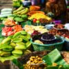 Colorful assortment of fresh fruits displayed for sale at a market stall.