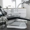 A contemporary dental office with a sleek dental chair and equipment, perfect for healthcare themed needs.