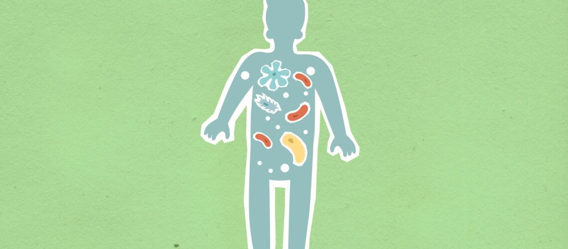 From above of cutout cardboard illustration of person with different bacteria spreading in body on green background