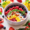 Colorful smoothie bowl with fresh fruits and almonds, perfect for a healthy breakfast.