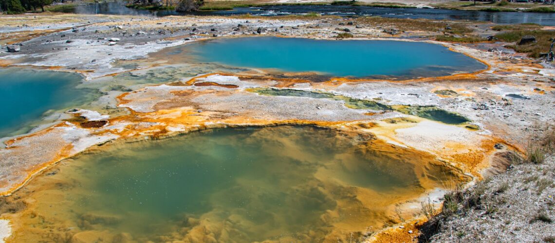 Aerial view of vibrant hot springs and landscape at Yellowstone National Park, USA.