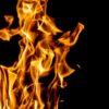 Captivating image of burning flames against a black backdrop, showcasing the dynamic nature of fire.